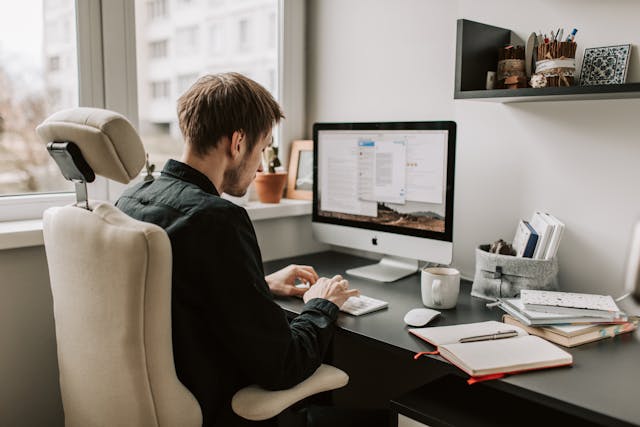 A man working at his workstation. 